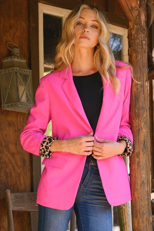 Bright pink jacket and leopard trousers